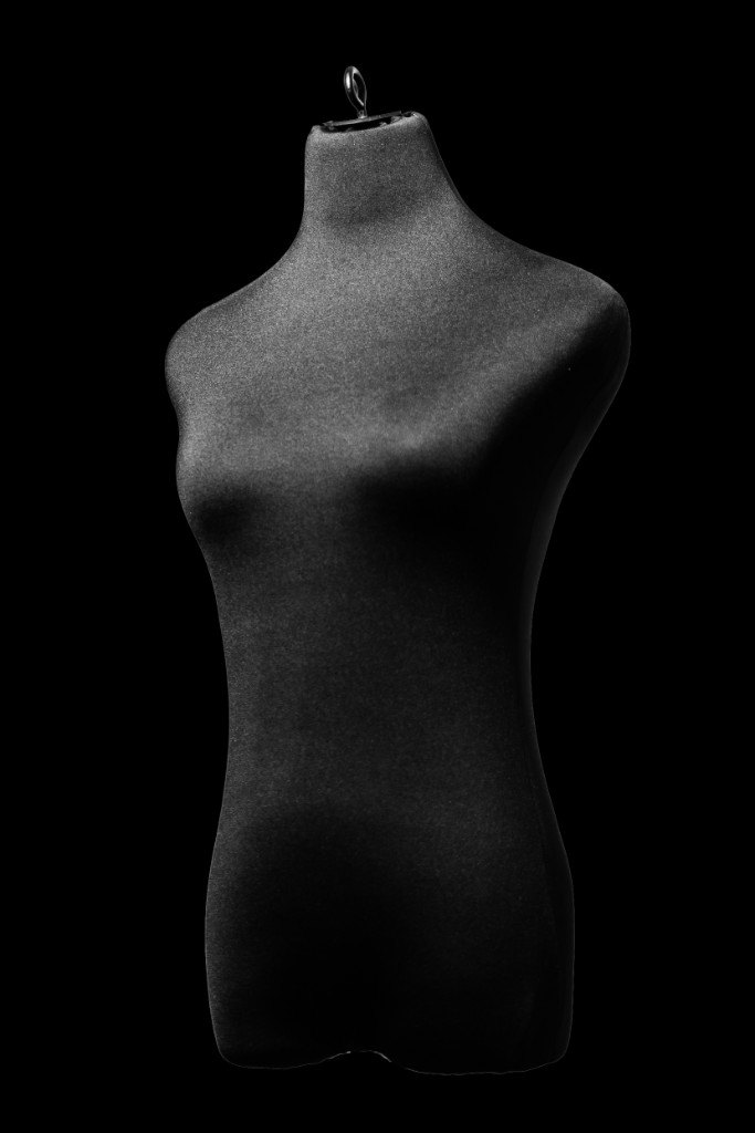 The Signature dress form, a black archival bust on a black ground