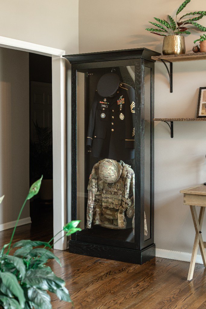 A freestanding Mrs. Case displaying a military dress uniform and service gear